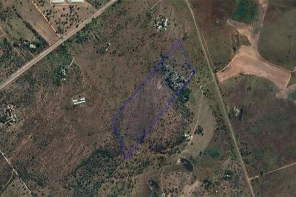An aerial view of the farm property showing the land boundaries and surrounding rural landscape.