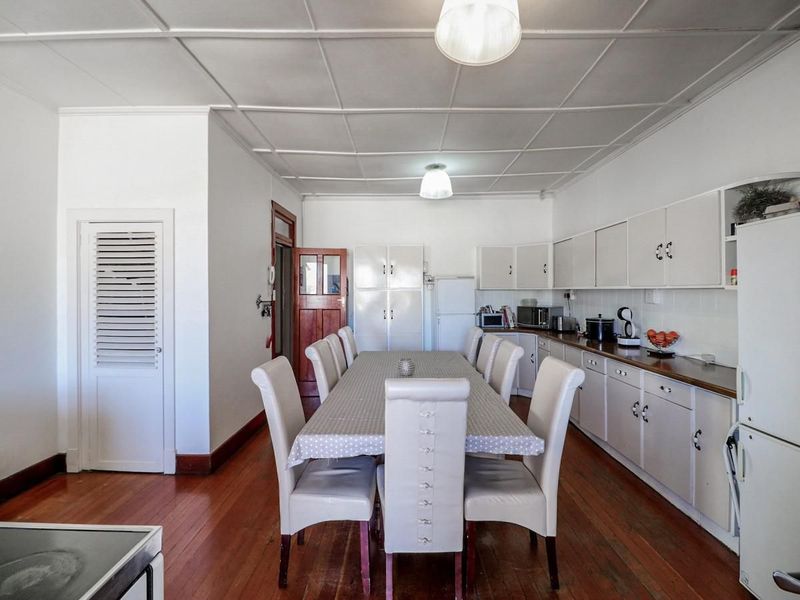 Charming 5-Bedroom Home with Timeless Wooden Floors & Exceptional Living Space - Photo 7