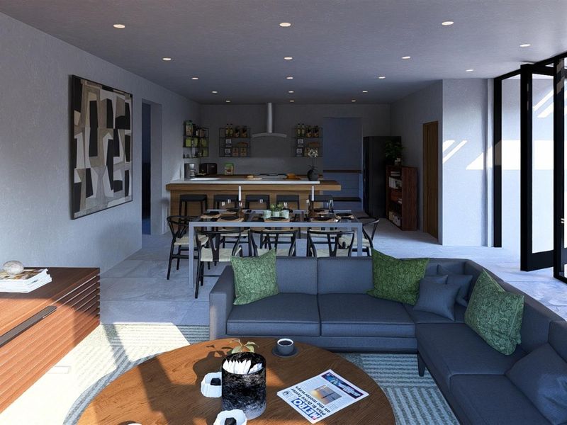 Modern open-plan living area featuring a contemporary kitchen with breakfast bar, dining space, and seamless access to outdoor areas through large glass doors.