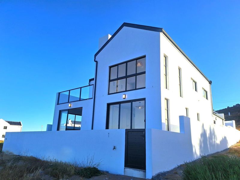 Brand New show-stopping Beachfront Home - a Coastal Gem. - Photo 2