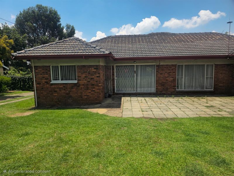 Rear view of the house featuring a brick facade, tiled roof, and a paved patio area leading onto a grass lawn.