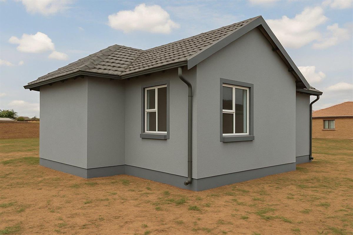 A view of the rear exterior of a modern house featuring grey rendered walls, a tiled roof, and downpipes.