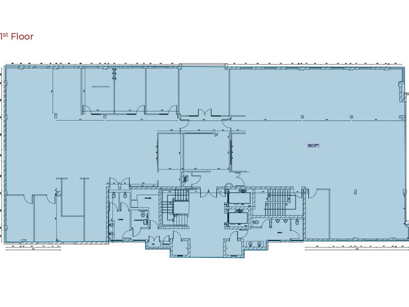 Architectural floor plan showing the layout of the first floor office space, including stairwells, elevator access, and partitioned office areas.