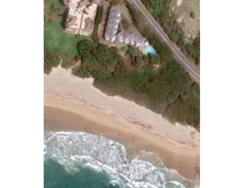 Aerial view of the commercial property showing its proximity to the coastline and beach access.