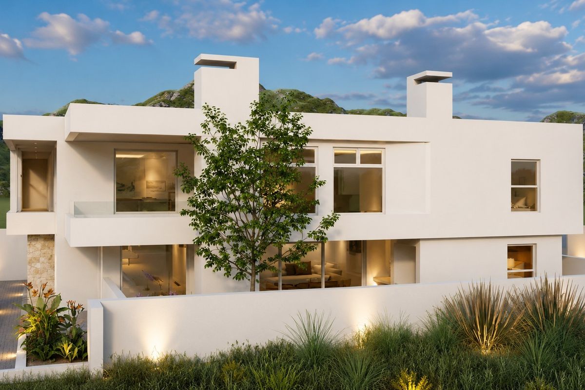 Modern two-story residential property featuring clean architectural lines, large windows, glass balustrades, and integrated exterior lighting set against a scenic mountain backdrop.
