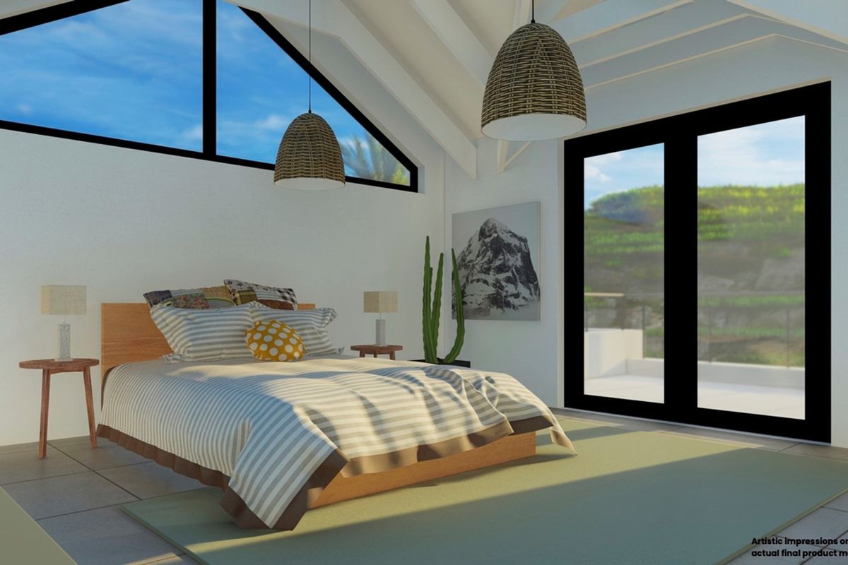 Spacious bedroom featuring vaulted ceilings, exposed beams, large triangular windows, and sliding glass doors leading to an outdoor area.