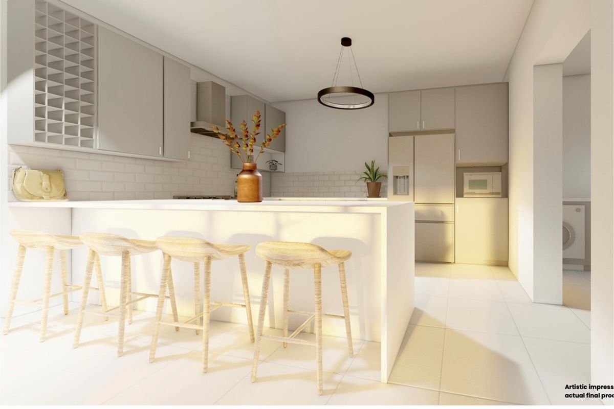 Modern kitchen featuring a central island with breakfast bar seating, sleek cabinetry, subway tile backsplash, and integrated appliances.