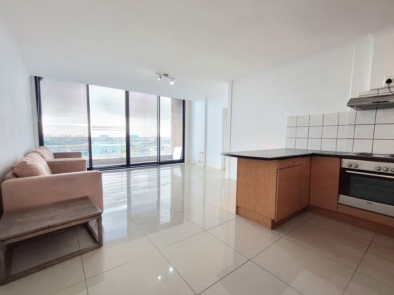 Step into light-filled, low-maintenance living with this modern and well-kept 1-bedroom apartment - Photo 2