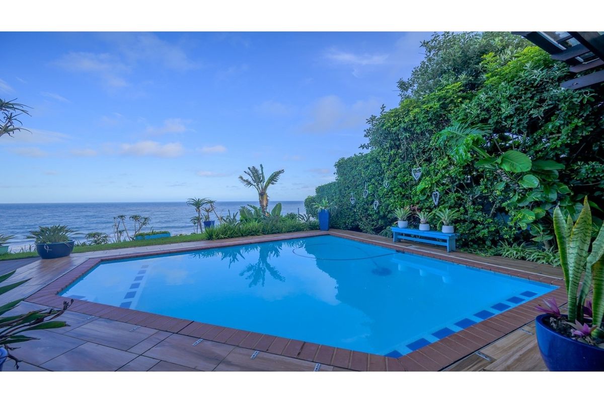 Accepting Reasonable Offers -Stunning Beachfront Home with Three Income Generating Apartments - Photo 4