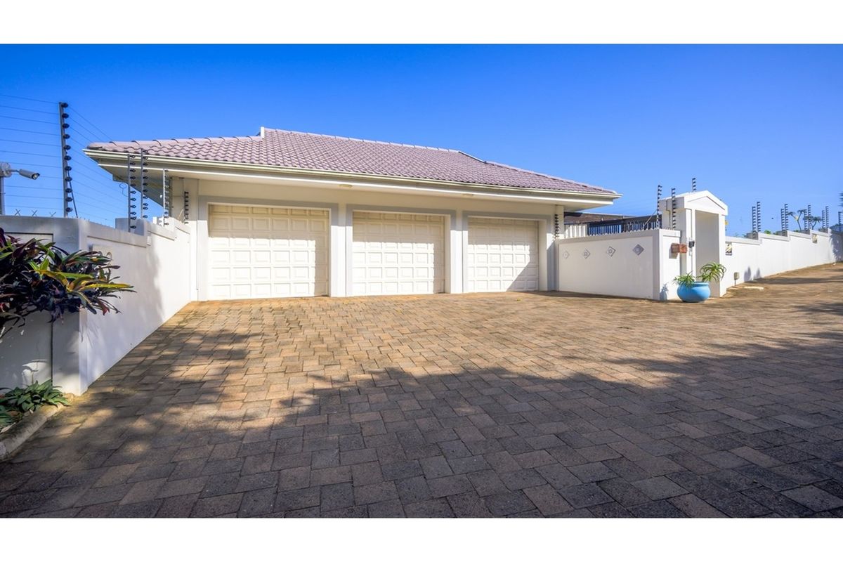 Accepting Reasonable Offers -Stunning Beachfront Home with Three Income Generating Apartments - Photo 2