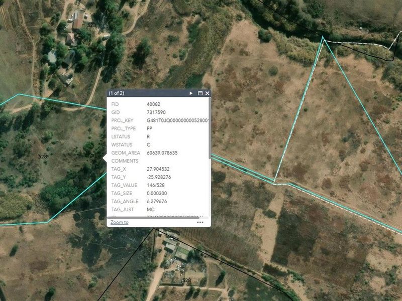 Aerial view of vacant residential land showing property boundaries and surrounding landscape.