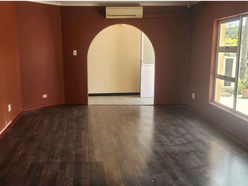 Spacious 4-bed, 3-bath home with modern kitchen, built-in braai and a lush child-friendly garden! - Photo 6