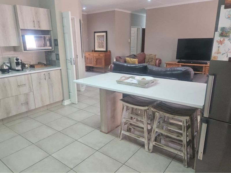 Modern Face Brick Family Home with Solar Power & Entertainment Area - Photo 8