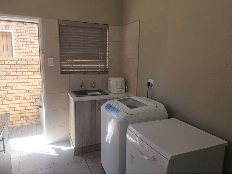 Modern Face Brick Family Home with Solar Power & Entertainment Area - Photo 10