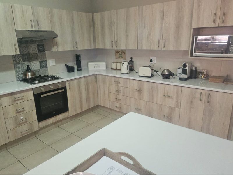 Modern Face Brick Family Home with Solar Power & Entertainment Area - Photo 7