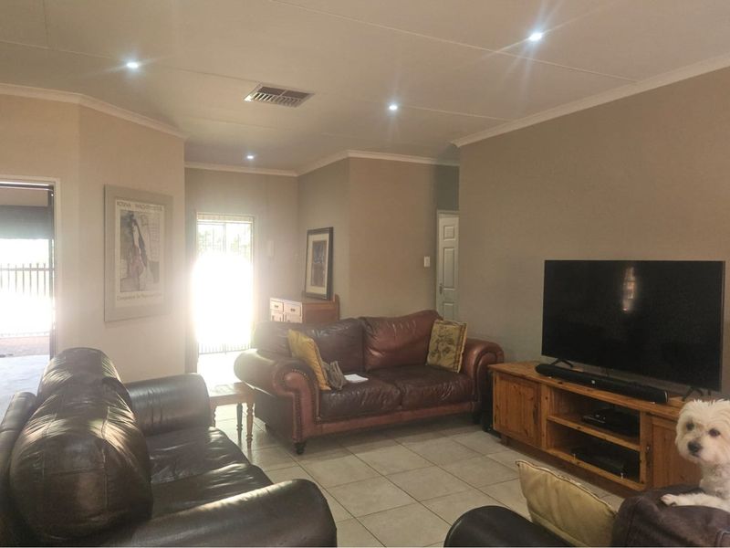 Modern Face Brick Family Home with Solar Power & Entertainment Area - Photo 4