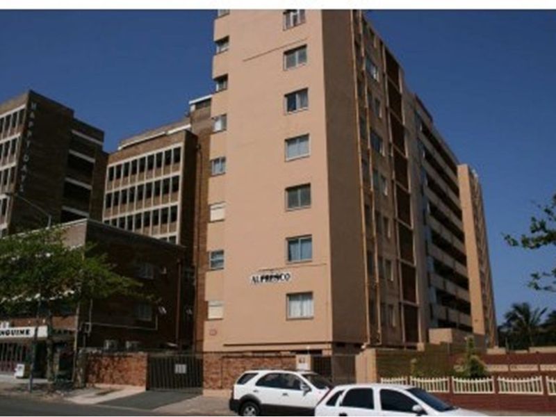 Exterior view of the Al Fresco apartment building, showcasing the multi-story residential facade and street-level entrance.