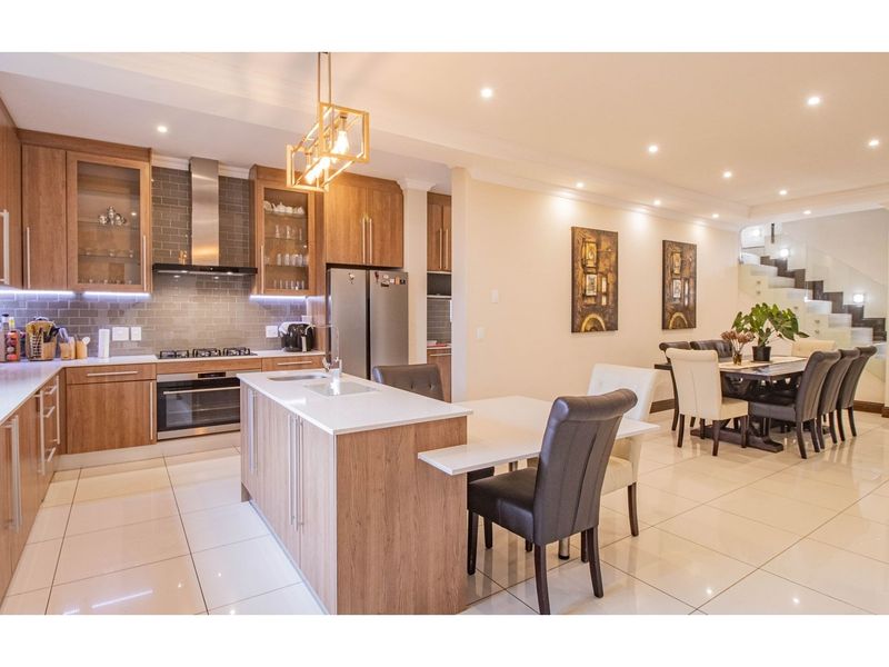 Modern Luxury Meets Family Comfort in Prestigious Sagewood - Photo 9