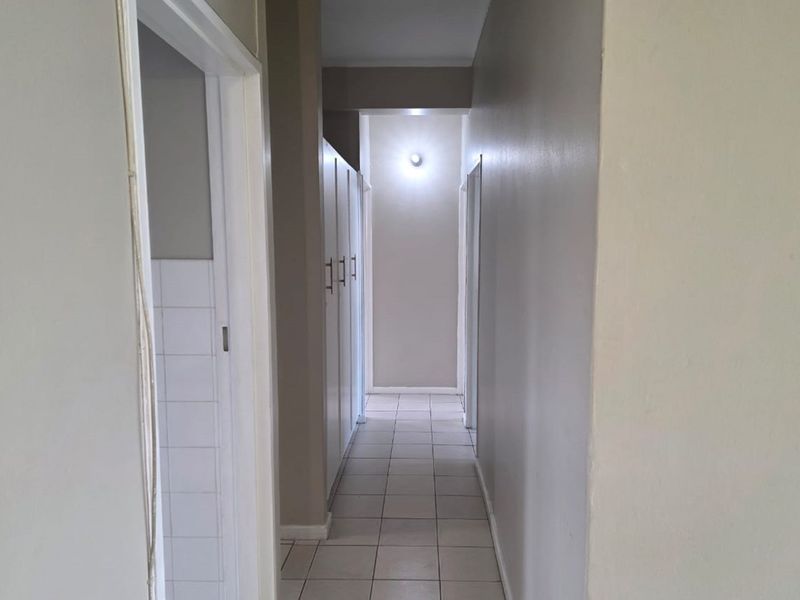 Ground-floor 3-bed apartment with closets, separate kitchen, veranda, and full burglar bars. - Photo 6