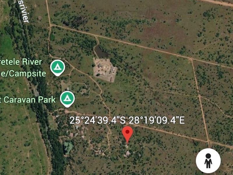 An aerial satellite view showing the rural farm property location and surrounding landscape.