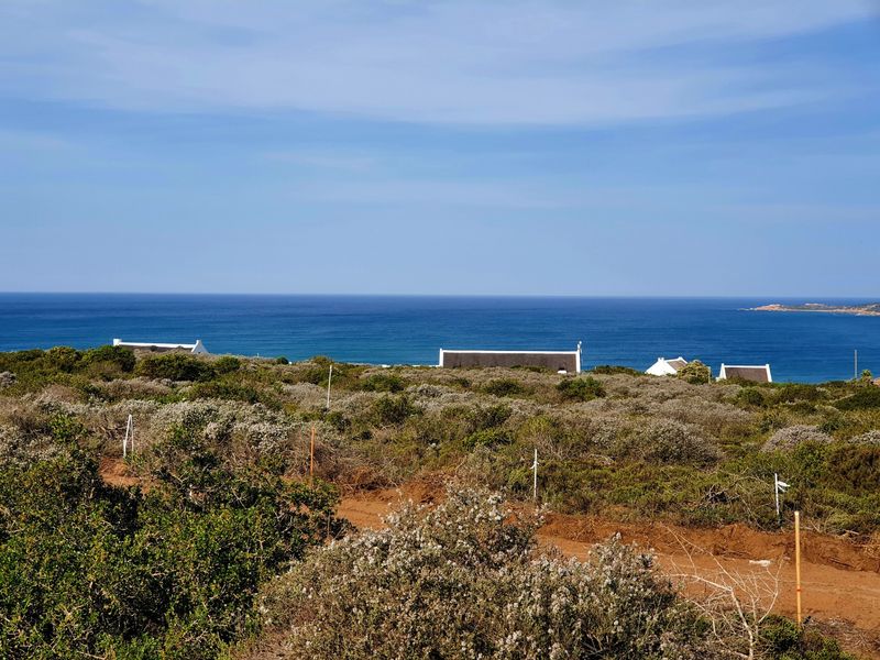 A scenic view of the ocean and coastal landscape from the vacant residential property.
