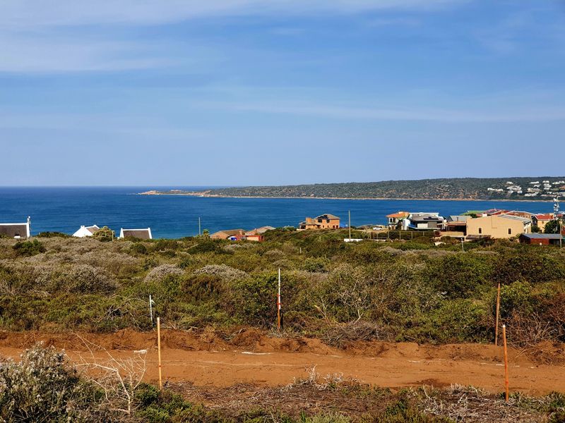 A scenic view overlooking the coastal landscape and ocean from the vacant residential property.