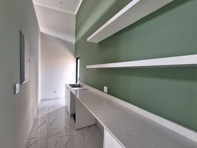 Modern Elegance Meets Coastal Tranquility at Palm Lakes Estate - Photo 6