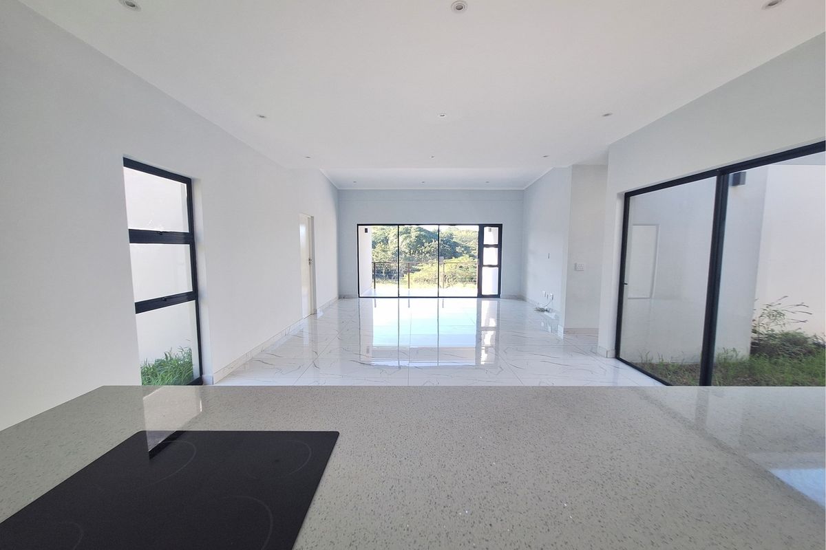 Modern Elegance Meets Coastal Tranquility at Palm Lakes Estate - Photo 5