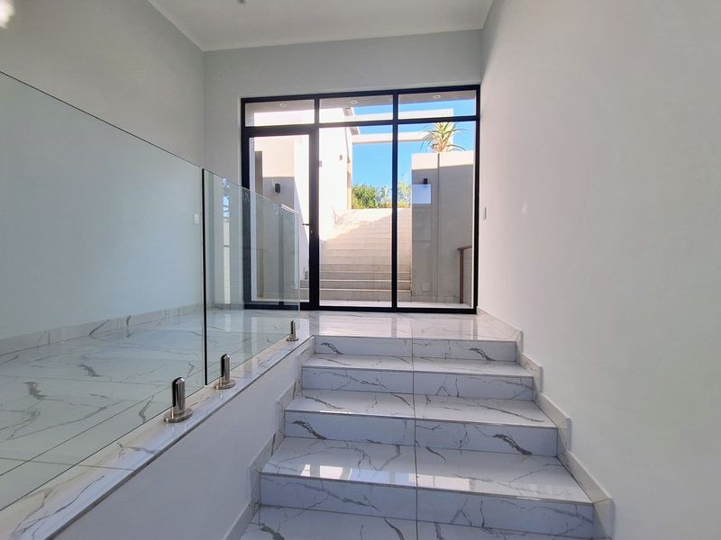 Modern Elegance Meets Coastal Tranquility at Palm Lakes Estate - Photo 2