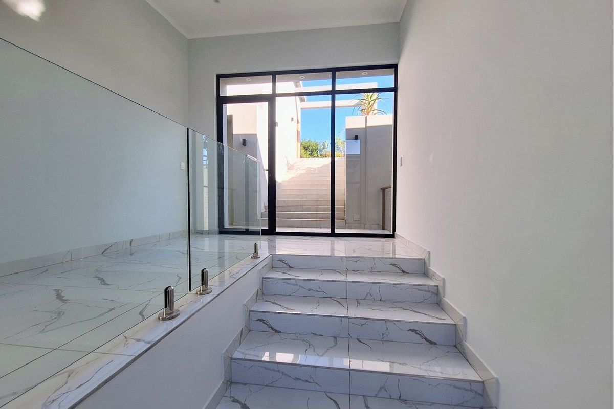 Modern Elegance Meets Coastal Tranquility at Palm Lakes Estate - Photo 2