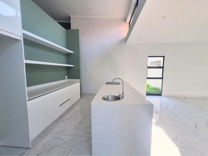 Modern Elegance Meets Coastal Tranquility at Palm Lakes Estate - Photo 4