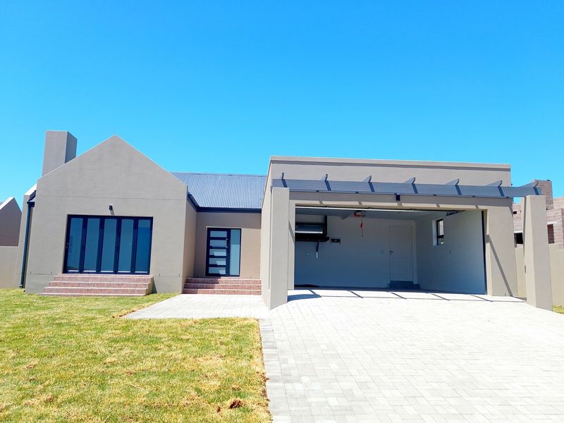Modern single-story home featuring a double garage, paved driveway, and contemporary architectural design with clean lines and neutral exterior finishes.