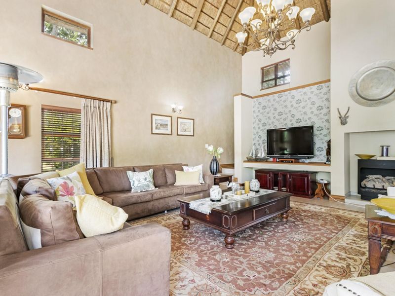 Elegant 5-Bedroom Home with Expansive Living Spaces and Exceptional Amenities - Photo 9