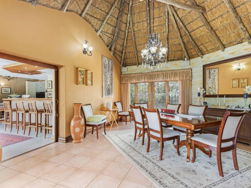 Elegant 5-Bedroom Home with Expansive Living Spaces and Exceptional Amenities - Photo 7