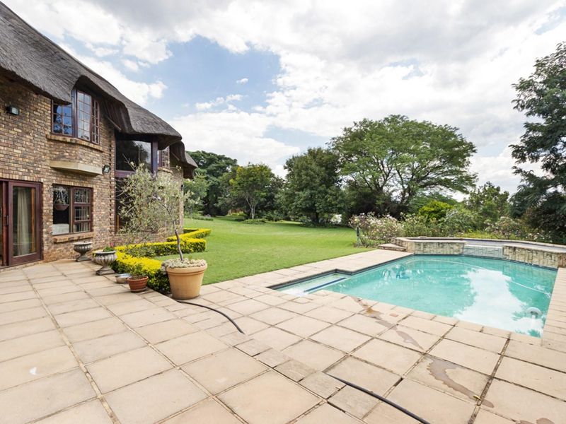 Elegant 5-Bedroom Home with Expansive Living Spaces and Exceptional Amenities - Photo 3