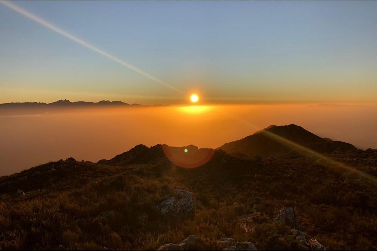A scenic sunset view over the mountainous landscape of the vacant residential property.
