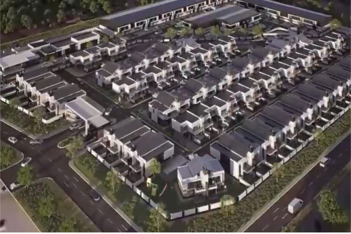 An aerial view of a modern residential apartment complex layout featuring multiple housing units, internal roads, and landscaped surroundings.