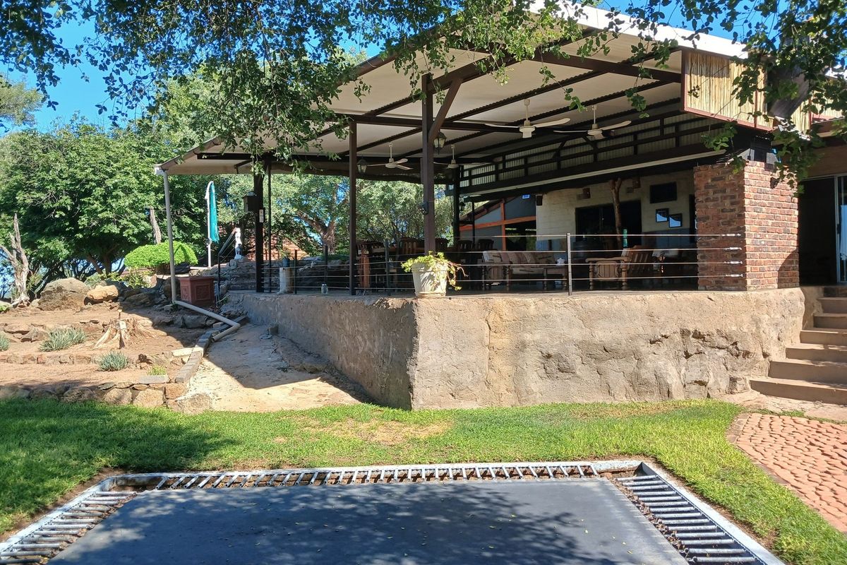 Situated in a stunning location, this Farmhouse with a Cottage in Grietjie private nature reserve - Photo 3