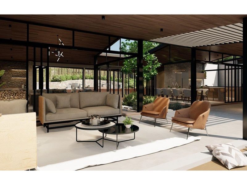 A modern open-plan living area featuring high ceilings, expansive glass walls, and seamless integration with outdoor spaces, showcasing contemporary architectural design.