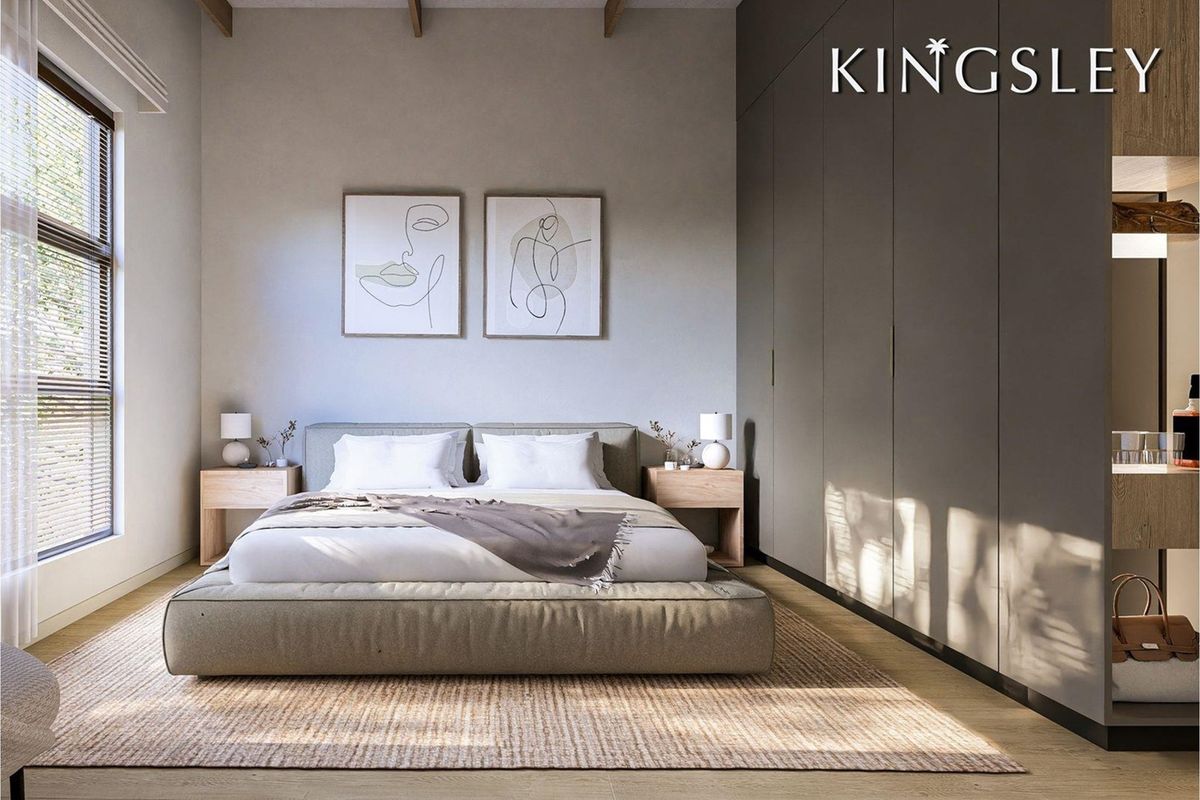 Modern bedroom featuring floor-to-ceiling built-in cupboards, exposed timber ceiling beams, and light timber flooring with natural light.