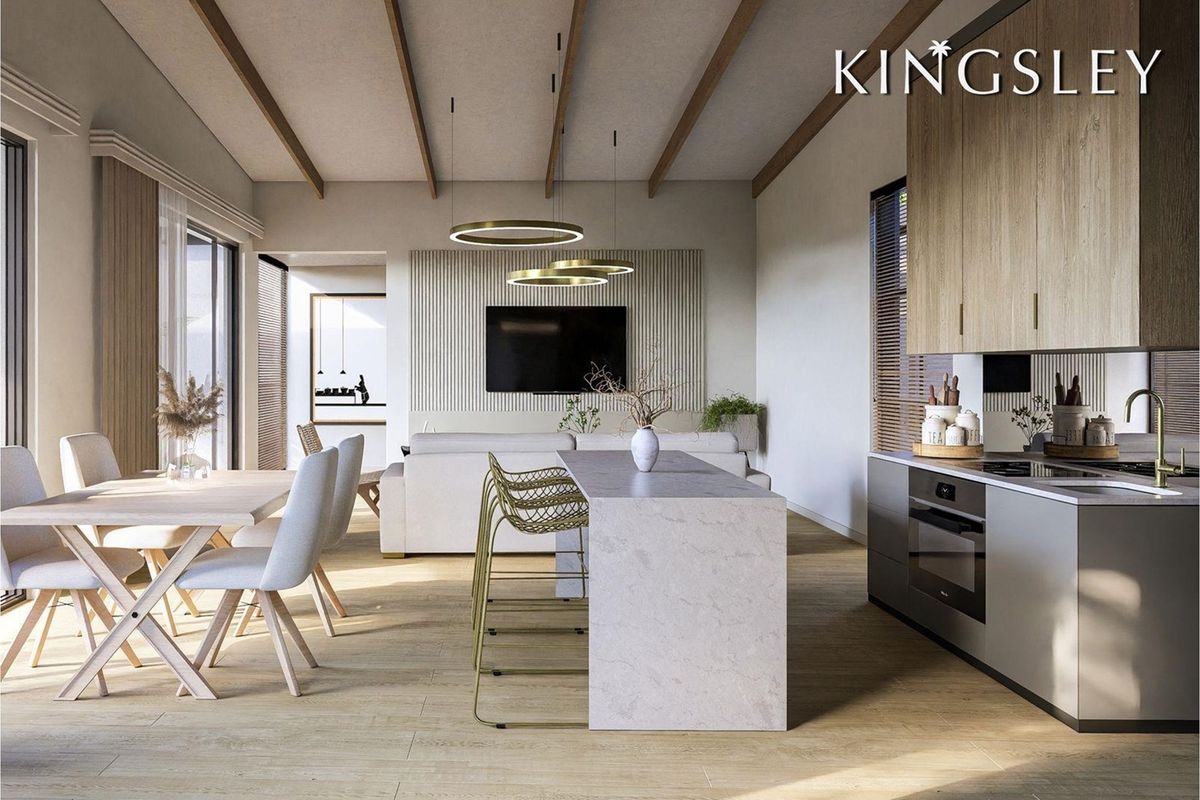 Modern open-plan living area featuring exposed timber beams, a sleek kitchen with stone island, and a contemporary slatted feature wall.