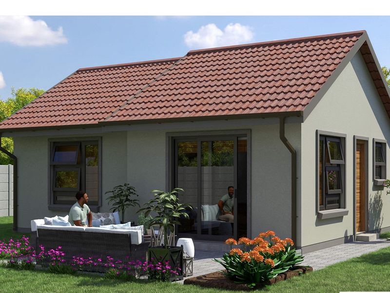 A modern residential exterior view featuring a tiled roof, sliding glass doors, and a paved patio area set within a landscaped garden.