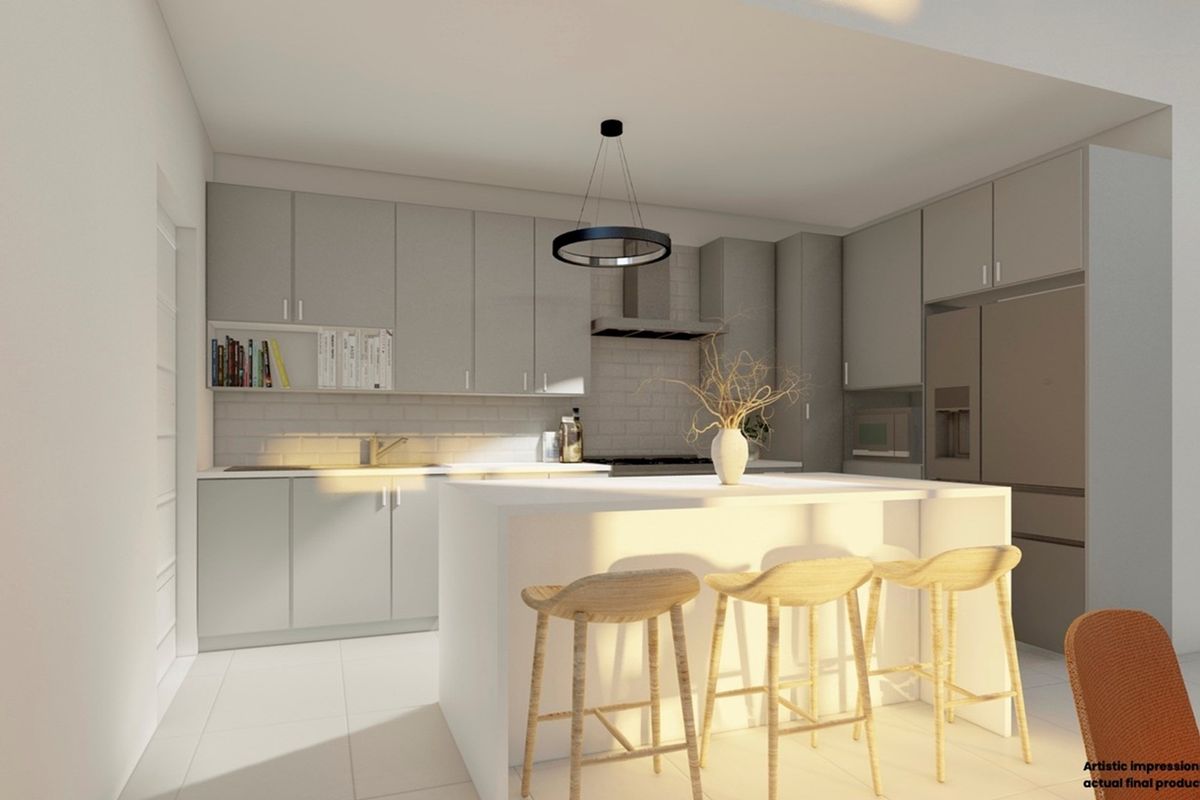 A modern kitchen featuring sleek cabinetry, a central island with breakfast seating, and integrated appliances in a bright, contemporary design.
