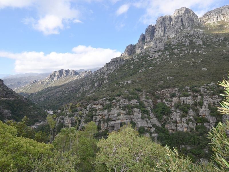 A scenic view of the rugged mountain landscape and natural rock formations surrounding the vacant residential land.