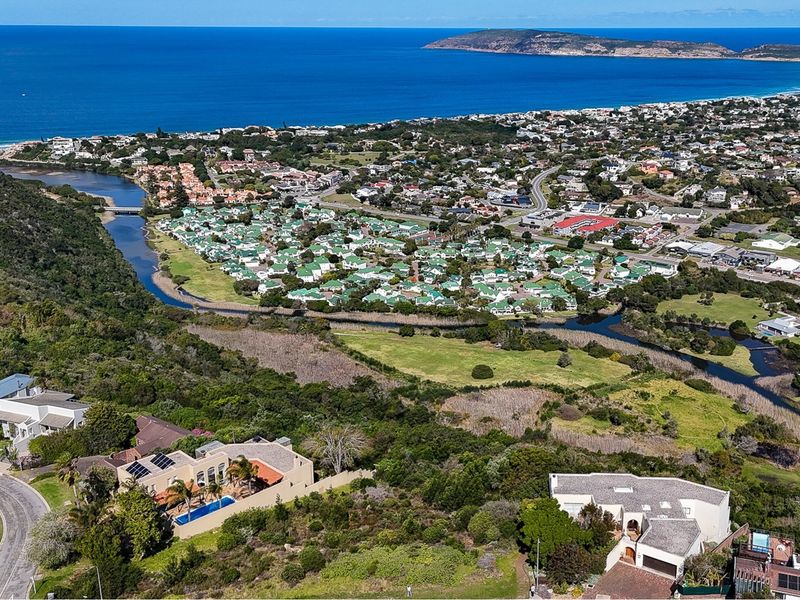 Aerial view of the residential area, showcasing the coastal landscape, nearby estuary, and surrounding neighborhood infrastructure.