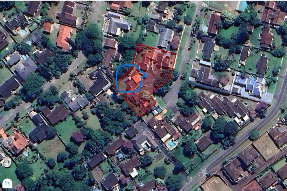 An aerial satellite view showing the property layout and surrounding residential neighbourhood context.
