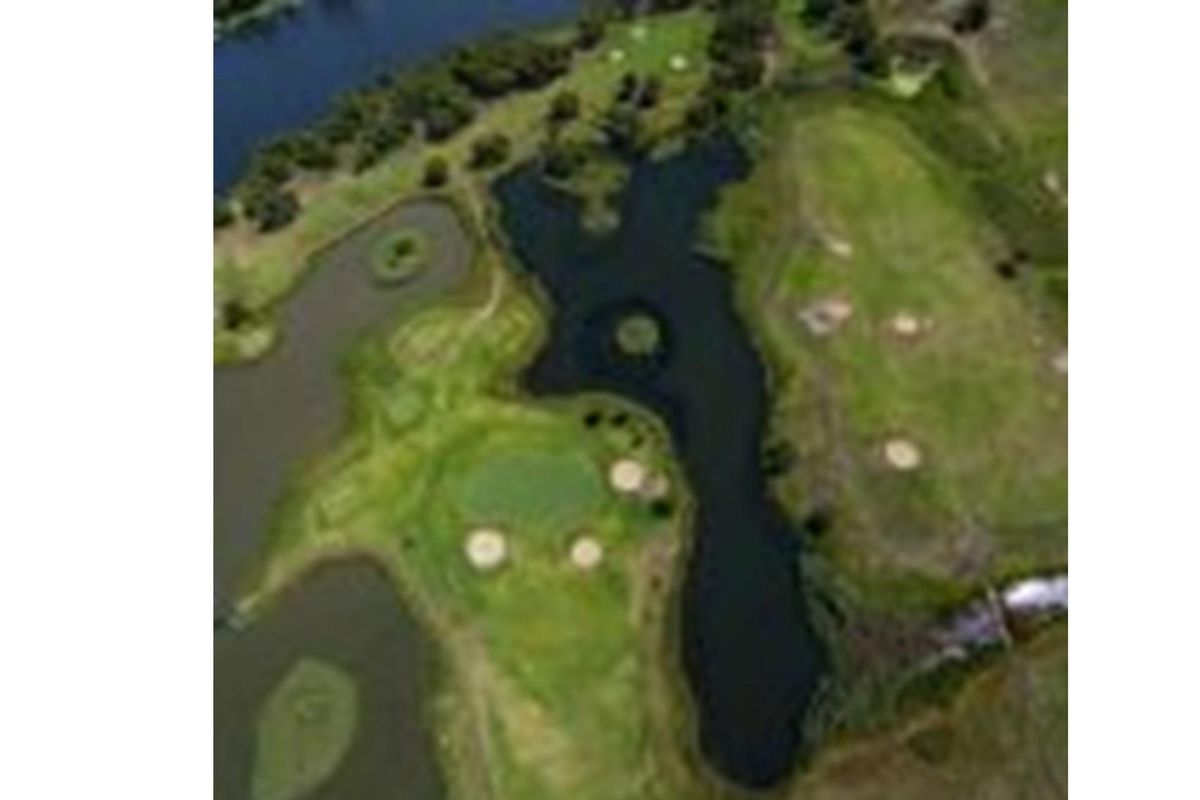 An aerial view of the residential land parcel, showcasing the surrounding landscape, natural water features, and green space.