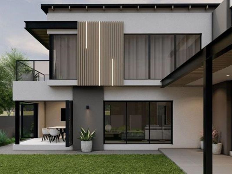 Modern double-story rear elevation featuring large glass sliding doors, a covered patio, and contemporary timber slat architectural detailing.