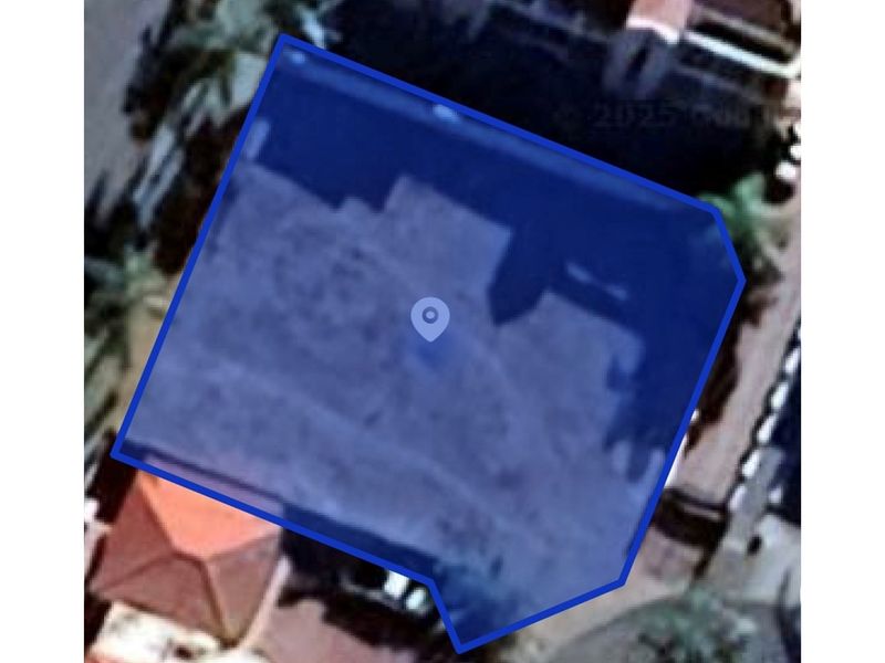 An aerial view of the vacant residential land plot, highlighting the property boundaries and location.