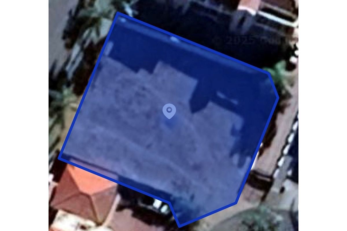 An aerial view of the vacant residential land plot, highlighting the property boundaries and location.